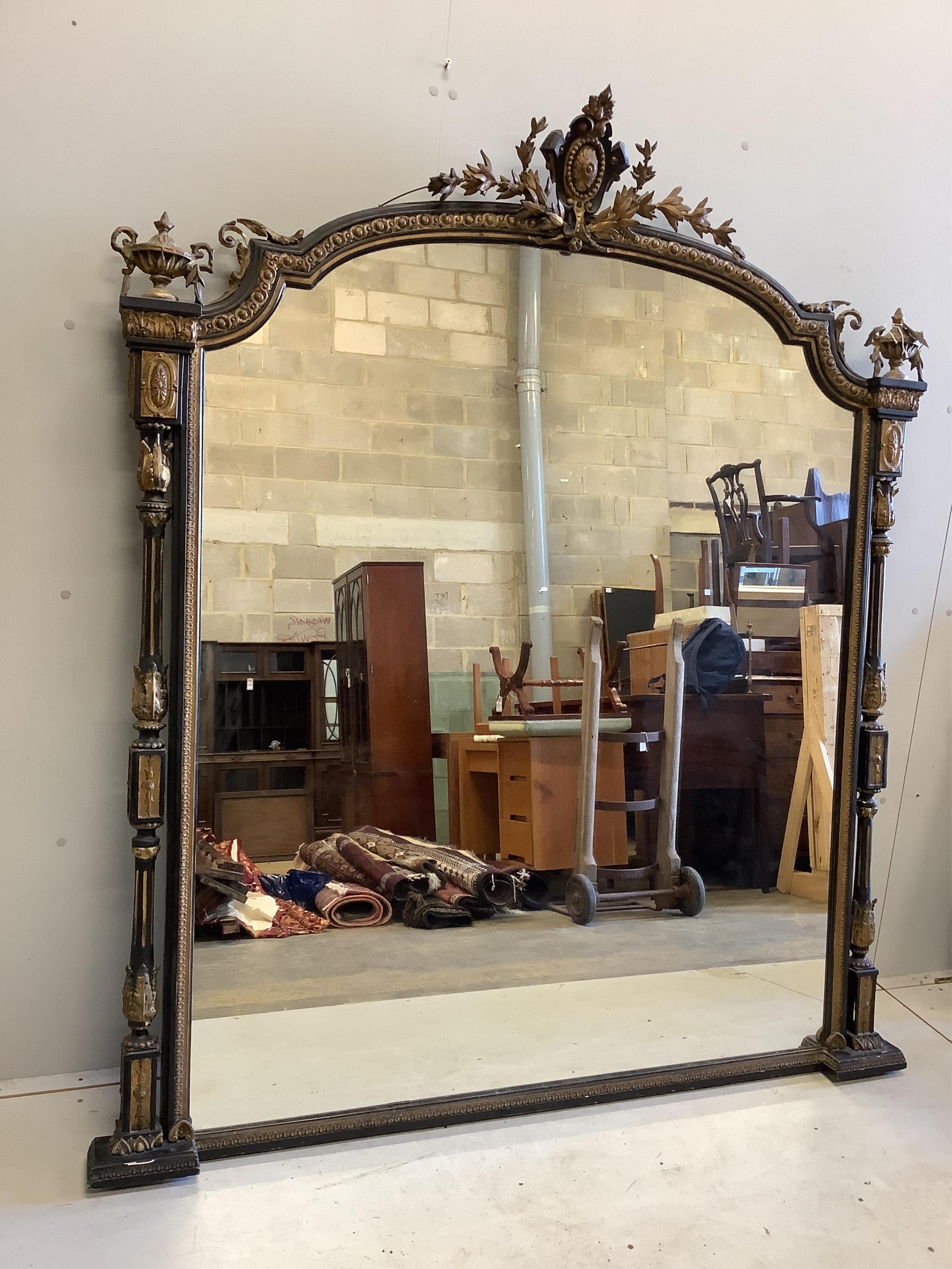 A large Victorian Rococo style giltwood and composition overmantel mirror, width 152cm, height 178cm. Condition - poor to fair